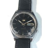 Vintage gents black dial Seiko 5 automatic 7009-3140 watch is ticking but no warranty is given glass