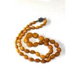 Antique egg yolk amber bead necklace measures approx 80cm long graduated sized beads largest