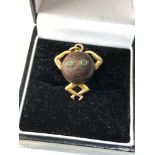 Antique 18ct gold mounted fumsup charm has emerald set eyes measures approx 2.1cm drop