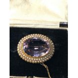 Antique 15ct gold amethyst and seed -pearl brooch measures approx 3.5 cm by 3cm centre stone