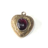Small gold antique garnet heart locket measures approx 20mm by 15mm missing glass on back