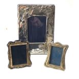 3 silver picture frames largest measures approx 24cm by 18cm