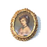 18ct gold framed hand painted miniature with diamond and jewel set accents measures approx 3.7cm