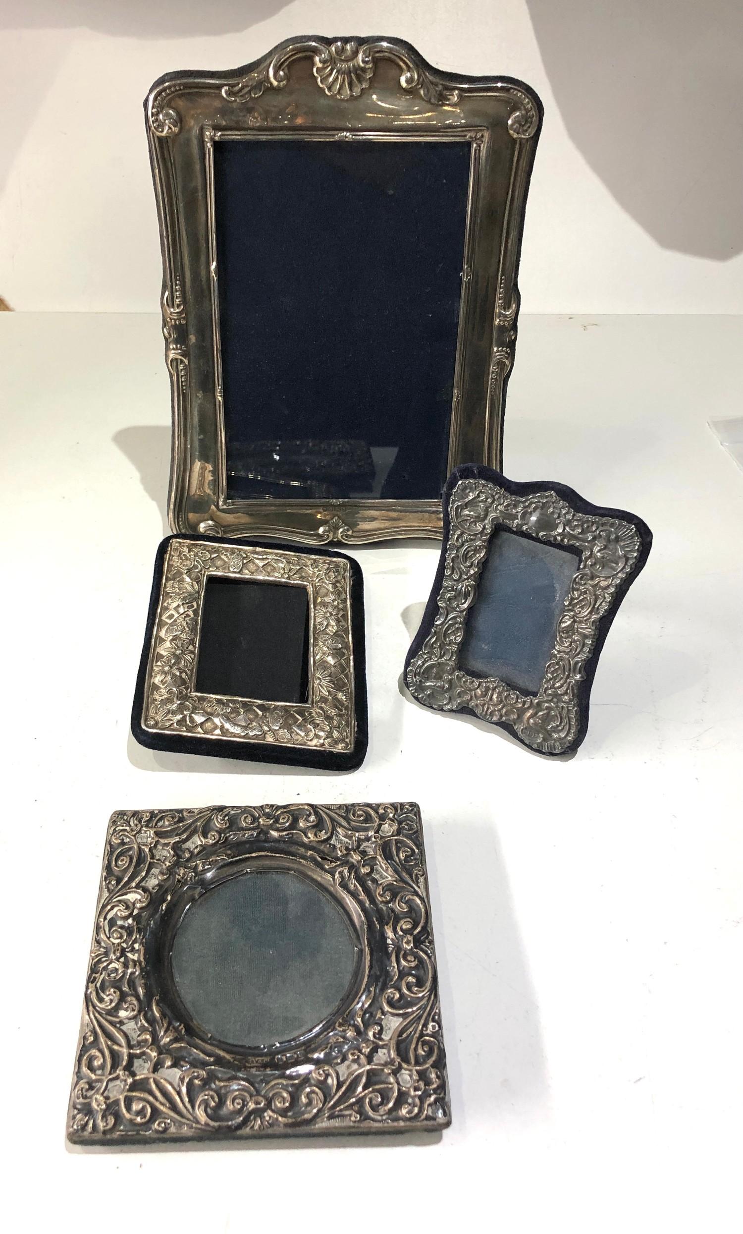 4 silver picture frames largest measures approx 20cm by 15cm