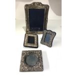 4 silver picture frames largest measures approx 20cm by 15cm