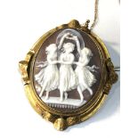large antique pinchbeck framed swivel cameo brooch measures approx 6.4 by 5.5cm in good condition