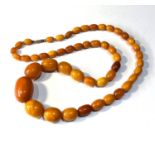 Antique egg yolk amber bead necklace measures approx 80cm long graduated beads