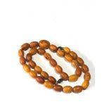 Antique egg yolk amber bead necklace measures approx 56cm long even sized beads measures approx 15mm