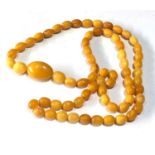 Antique egg yolk amber bead necklace measures approx 88cm long graduated sized beads large bead