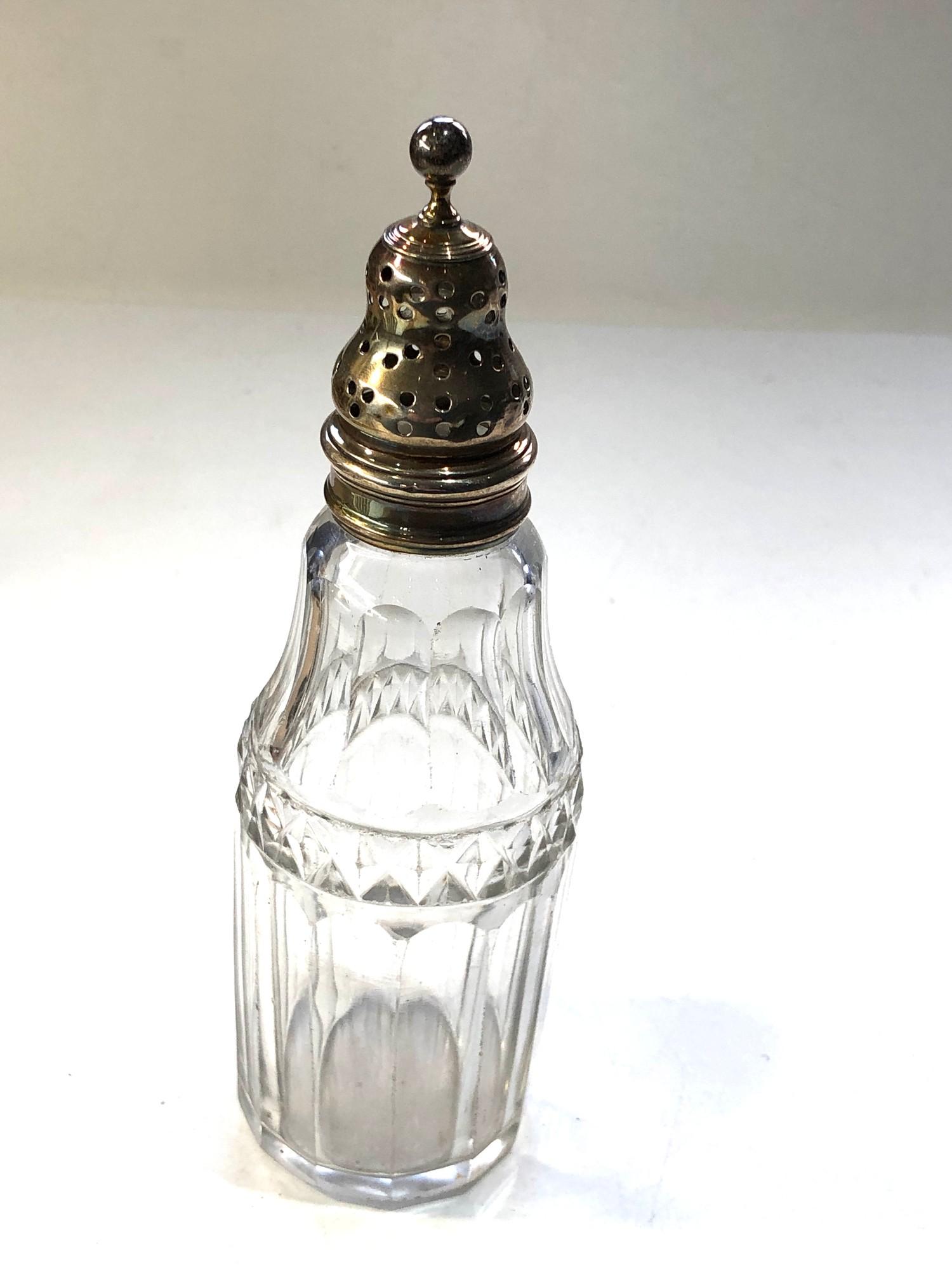 Antique Georgian silver top and glass pepper in good condition measures approx 16cm tall