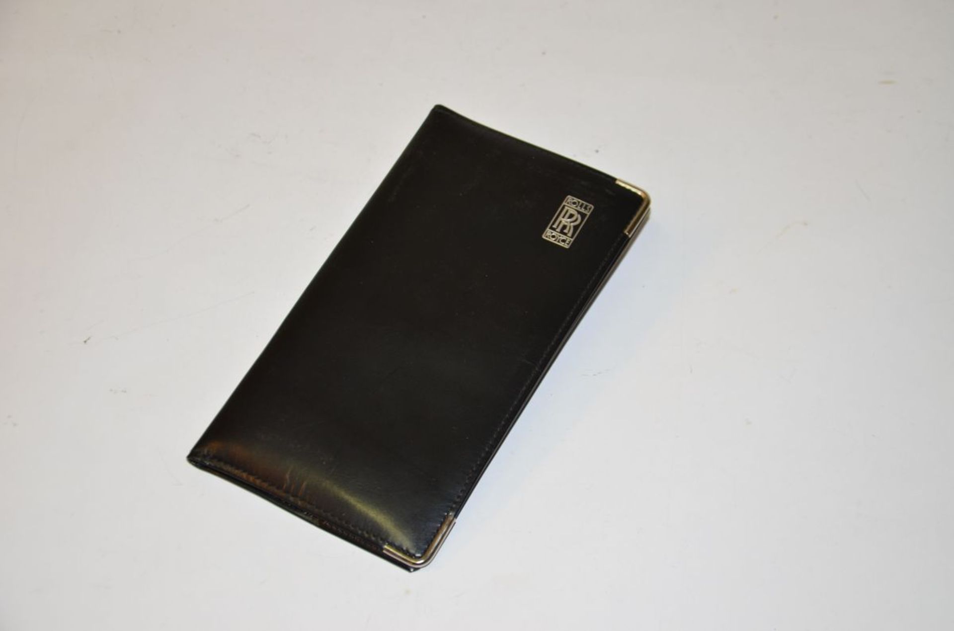 Black, leather Rolls-Royce checkbook case with notepad