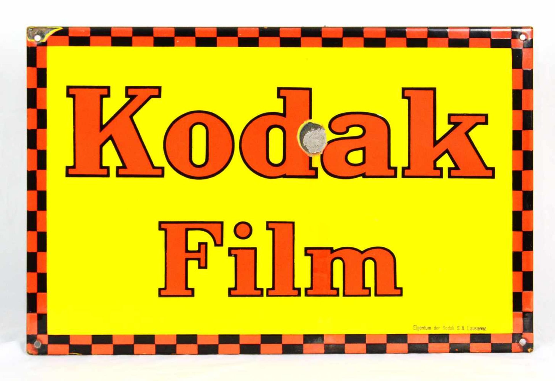 Enamel sign Kodak FilmThis enamel Kodak Film sign has 1 cm side edge and 4 mounting holes. Overall