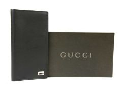 A Gucci black leather long wallet