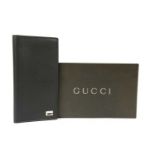 A Gucci black leather long wallet