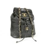A vintage Chanel black lambskin leather backpack