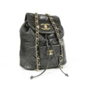 A vintage Chanel black lambskin leather backpack