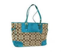 A Coach teal suede and monogrammed canvas tote bag