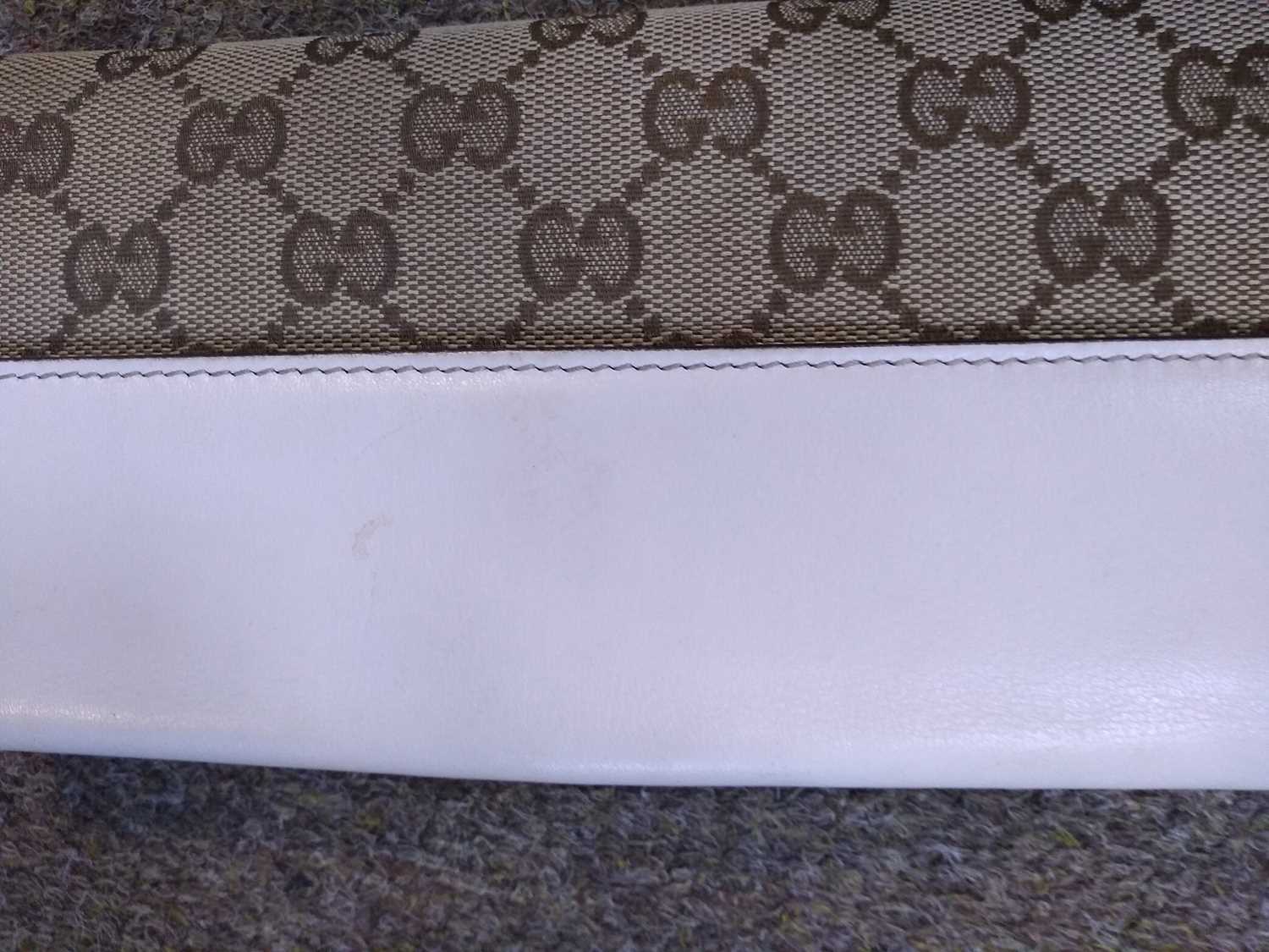 A Gucci beige monogrammed canvas and cream leather heart bi-fold wallet, - Image 10 of 13