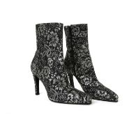 A pair of Charles Jourdan black and silver ankle boots