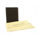 A Louis Vuitton brown taiga leather desk agenda cover