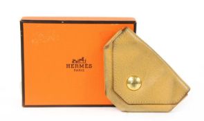 An Hermès gold courchevel leather '24 Change' purse,