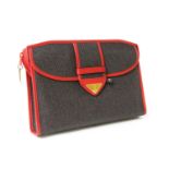 A vintage Yves Saint Laurent brown and red coated canvas clutch