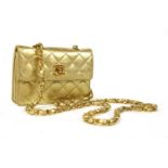 A Chanel gold mini flap bag