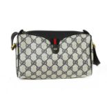 A Gucci Accessory Collection beige coated canvas and blue leather zip shoulder bag