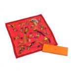 An Hermès silk scarf,