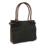 A Gucci dark brown canvas curved handle bag