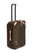 A Louis Vuitton monogrammed canvas 'Pégase Légère 65' suitcase,