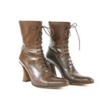 A pair of Michel Perry brown leather ankle boots