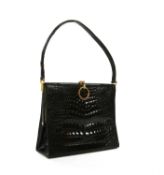 A vintage black crocodile leather handbag,