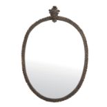 ARMAND-ALBERT RATEAU (1882-1938) - Petit miroir ovale, encadrement en bronze doré [...]