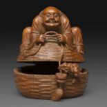 STATUETTE - en bambou, finement sculpté et ajouré, représentant Liu Hai assis sur [...]