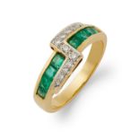 An emerald and diamond ring.