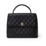 Chanel - a vintage black quilted lambskin leather Kelly handbag.