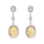 A pair of citrine and diamond earrings.