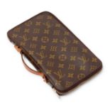 Louis Vuitton - a vintage Monogram zipped travel wallet.