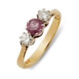 An 18ct gold ruby and diamond three-stone ring.