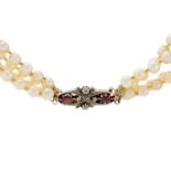 A cultured pearl four-row necklace, with a Victorian ruby and diamond clasp.