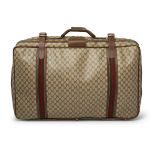 Gucci - a vintage GG Supreme suitcase.