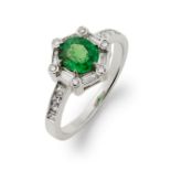 An emerald and diamond ring.