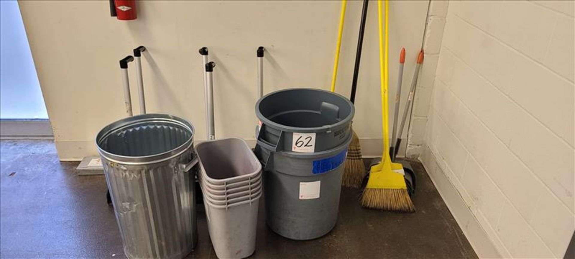 Misc. Cleaning Supplies, brooms, dust pans, and trash bins.