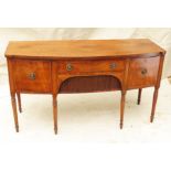 Early 19th Century Regency Mahogany Sideboard, of bowfronted form having three drawers and tambour