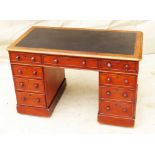 Mid 19th Century Mahogany Pedestal Desk of diminutive proportion having leather inset top over