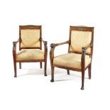 A pair of Empire carved mahogany and gilt bronze mounted fauteuils