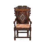 A Charles II carved oak and parquetry open armchair, Leeds, Yorkshire