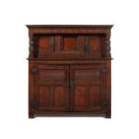 A Charles I carved oak press cupboard