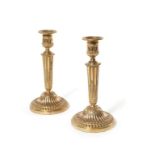 A pair of Louis XVI gilt bronze candlesticks